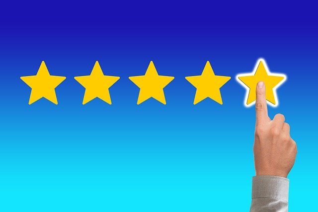 A person leaving a five-star review, symbolizing how online reviews benefit your moving business